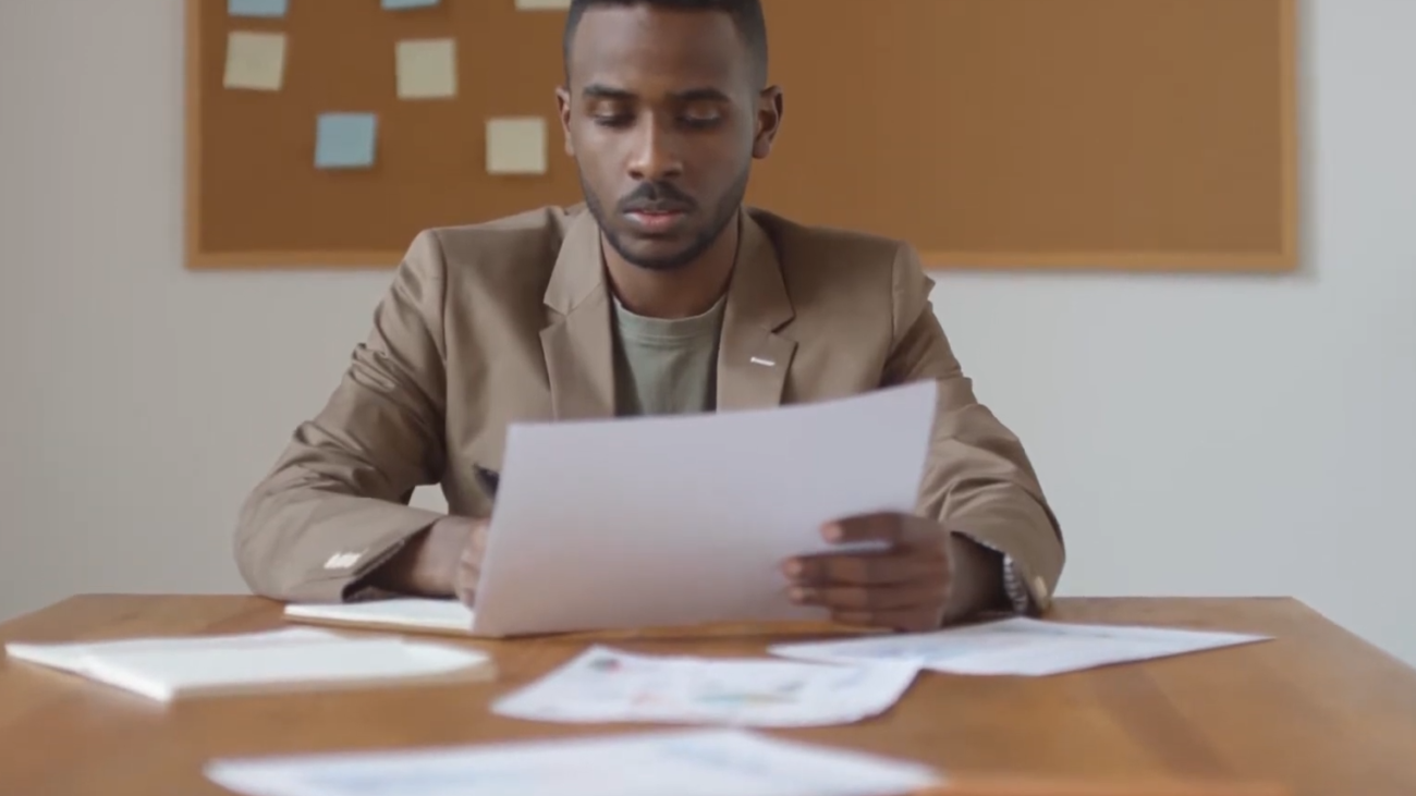 Man signing paperwork