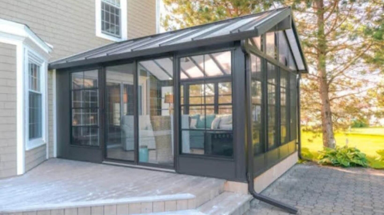 Stylish 3-season sunroom with a sturdy aluminum frame and expansive windows.